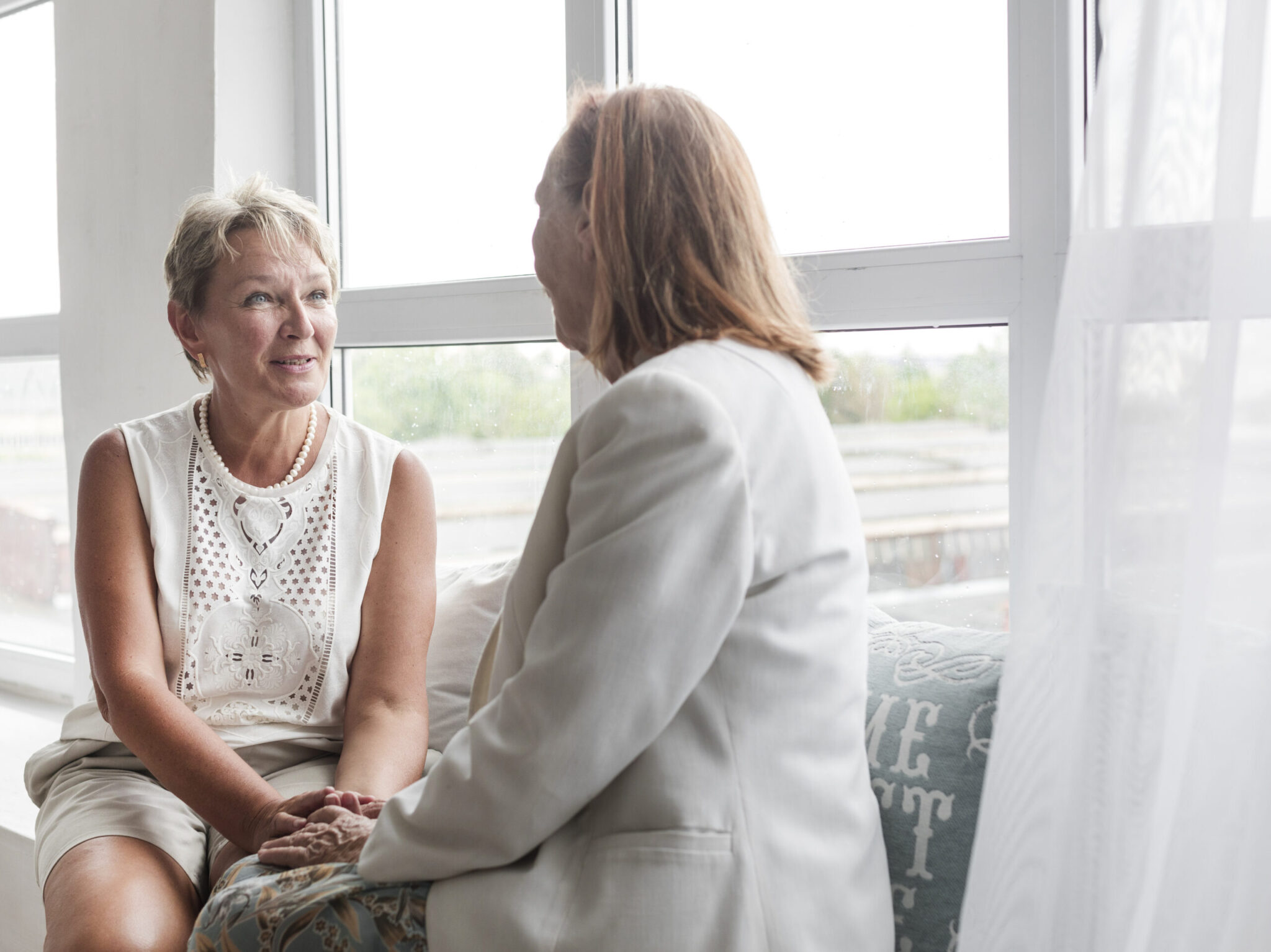 Adult Daughter Talking to Mother